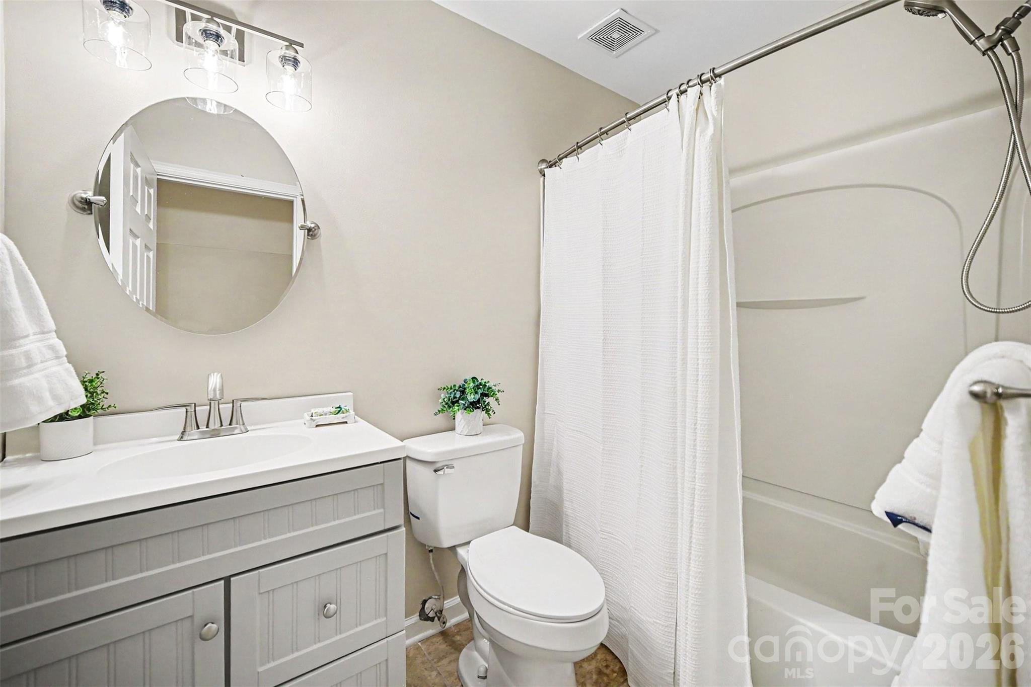 1210 Sheldon Brook Lane Fort Mill, SC 29707 - Photo 13 of 26 a bathroom with a toilet a sink and a mirror