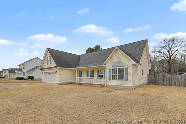 a house with trees in the background
