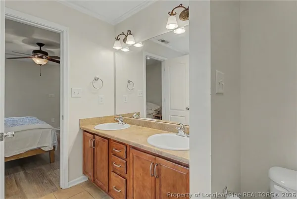 a bathroom with a sink a vanity and a mirror
