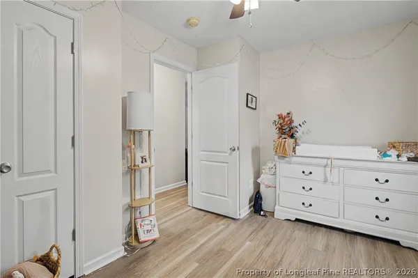 a view of a dresser with wooden floor