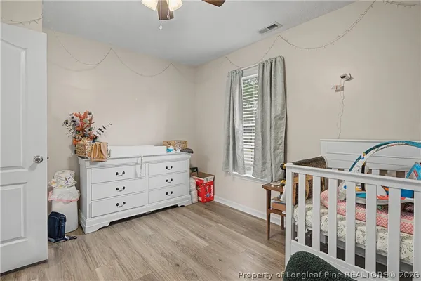 a bedroom with furniture and a window