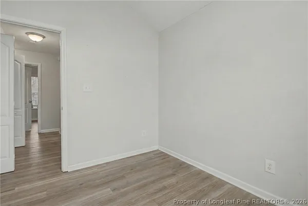 a view of a small space with wooden floor