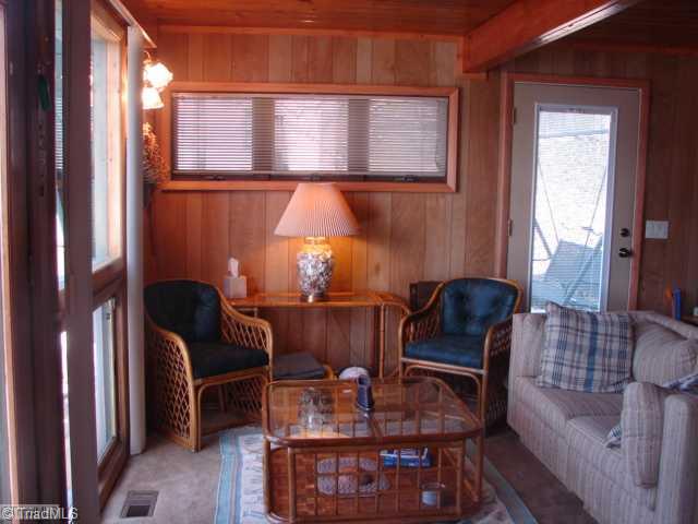 463 Betty Craven Road Denton, NC 27239 - Photo 11 of 16 Den/Family/Great Room. Another view of the den area. Views of the lake from all of the windows.