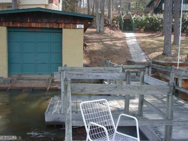 463 Betty Craven Road Denton, NC 27239 - Photo 15 of 16 View. view of boathouse and walkway coming down to pier and waterside deck.