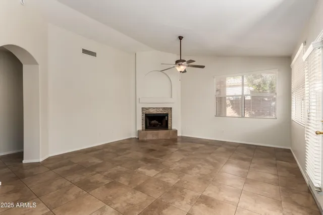 a view of an empty room with windows