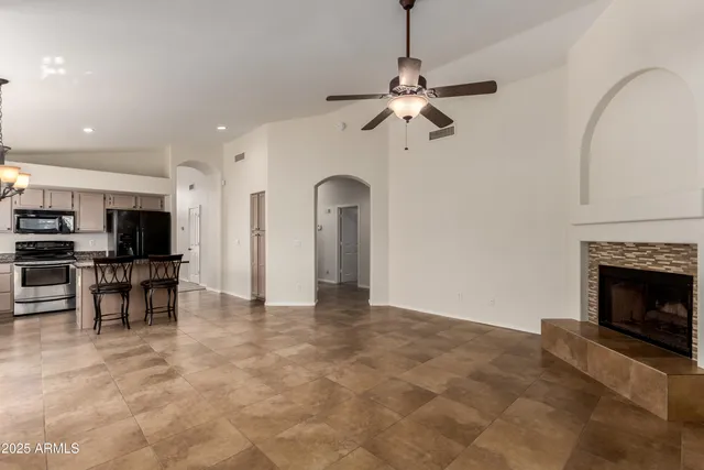 a view of a kitchen with furniture and a fireplace