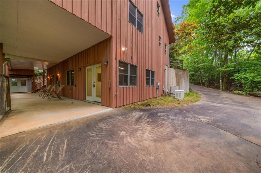 470 Sautee Ridge Road Clarkesville, GA 30523 - Photo 25 of 37 a view of a house with backyard and parking