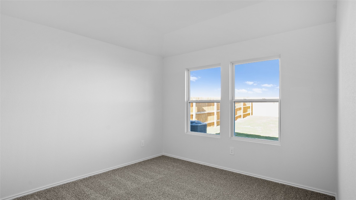 105 Celosia Loop Kyle, TX 78640 - Photo 12 of 14 an empty room with a window