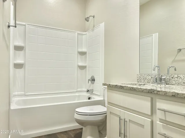 a bathroom with a sink a toilet and a bathtub