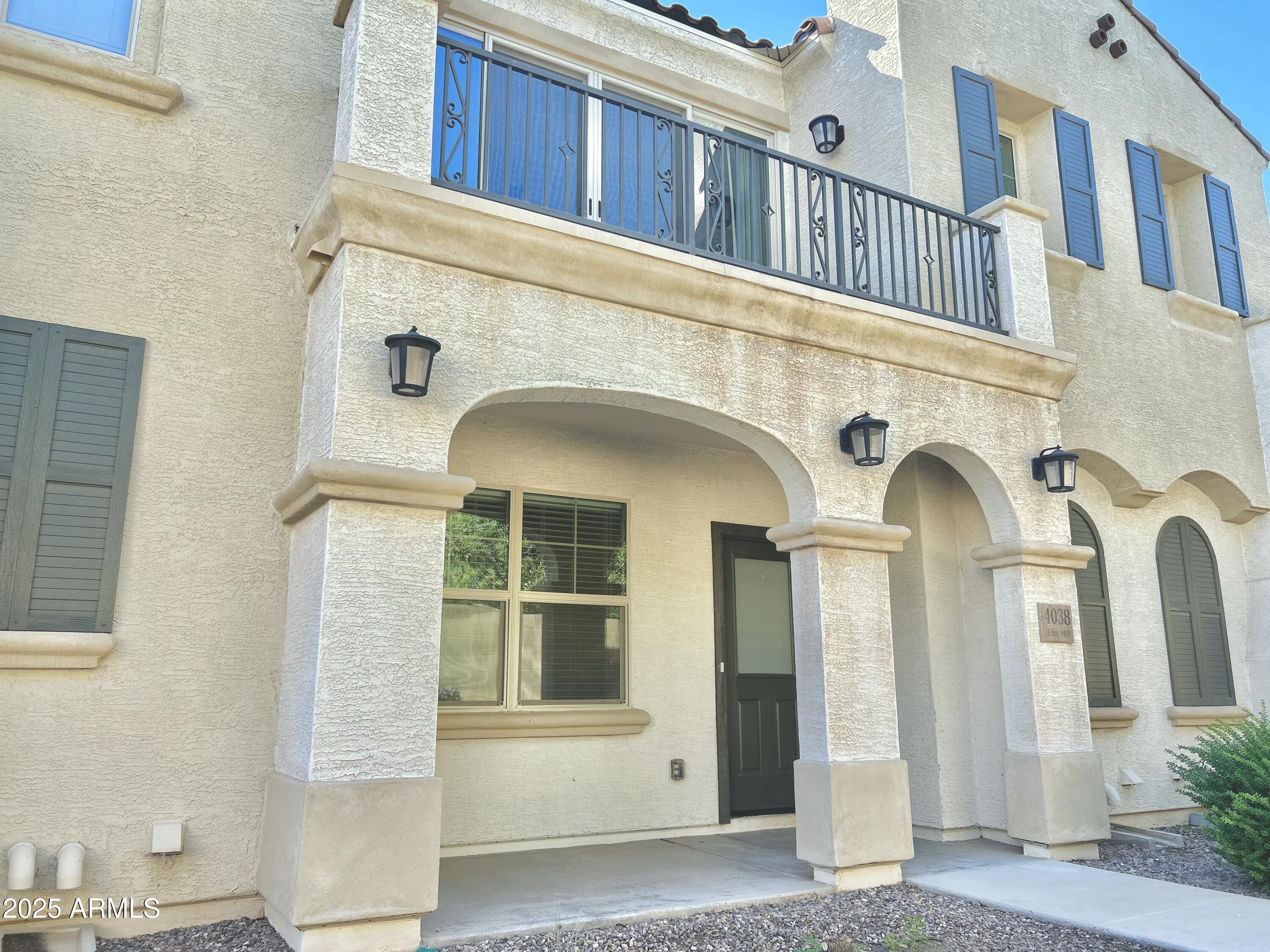 4038 East Erie Street, Unit 103 Gilbert, AZ 85295 - Photo 2 of 16 a view of a white building