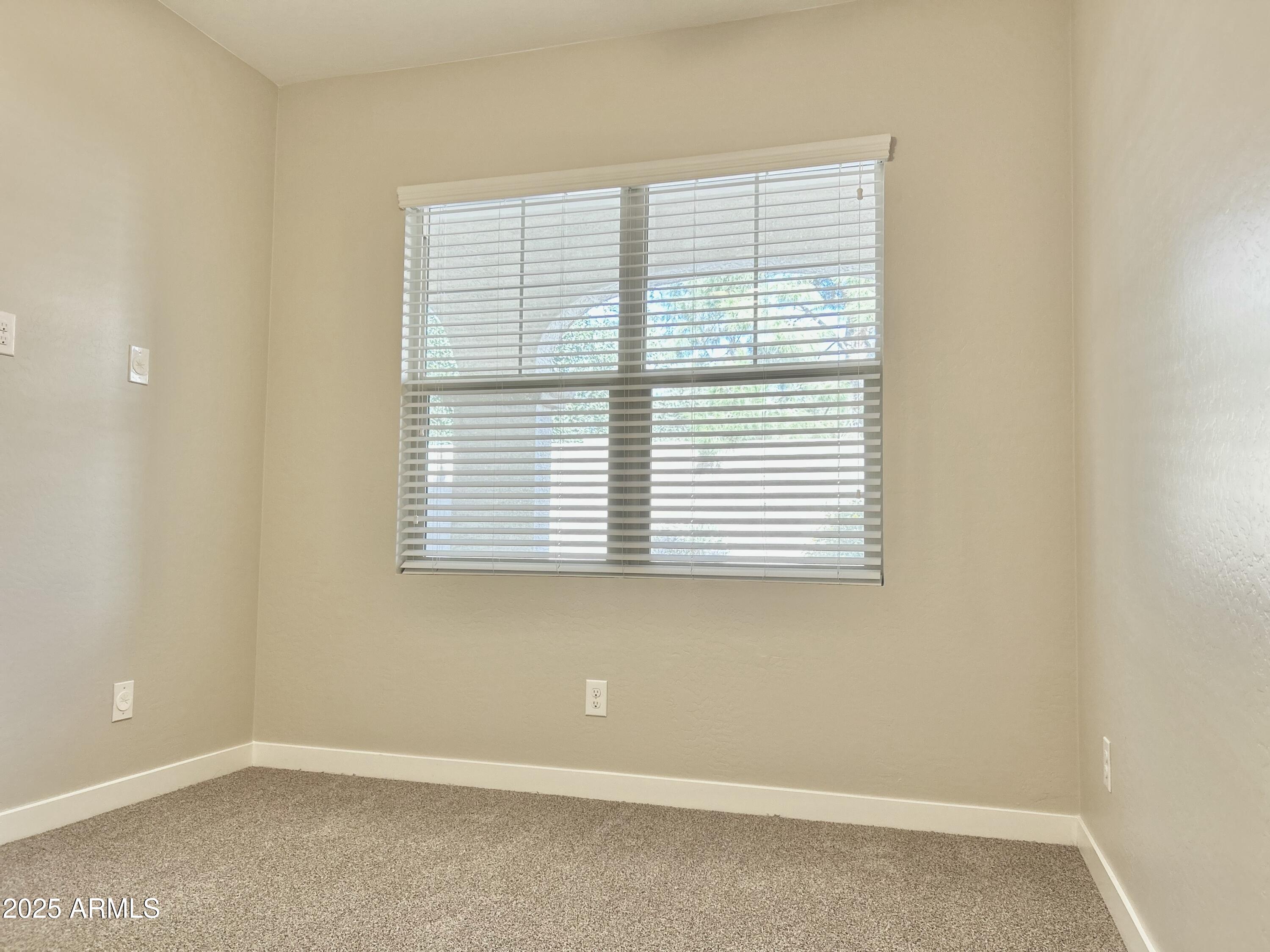 4038 East Erie Street, Unit 103 Gilbert, AZ 85295 - Photo 3 of 16 an empty room with a window