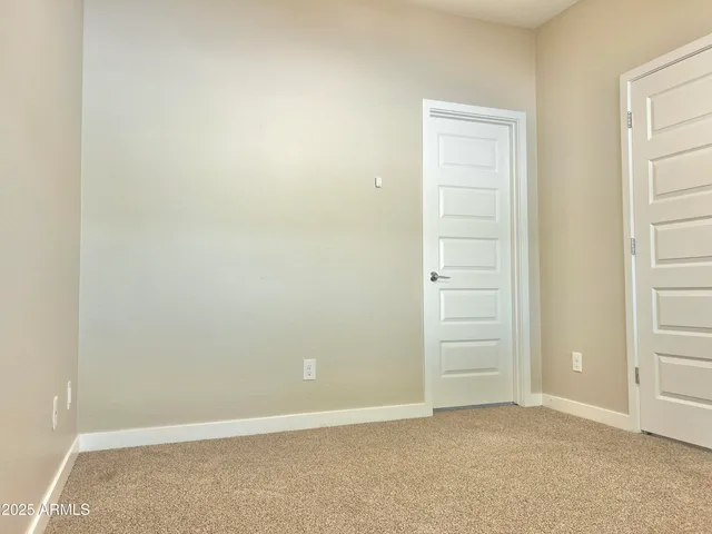 an empty room with closet area