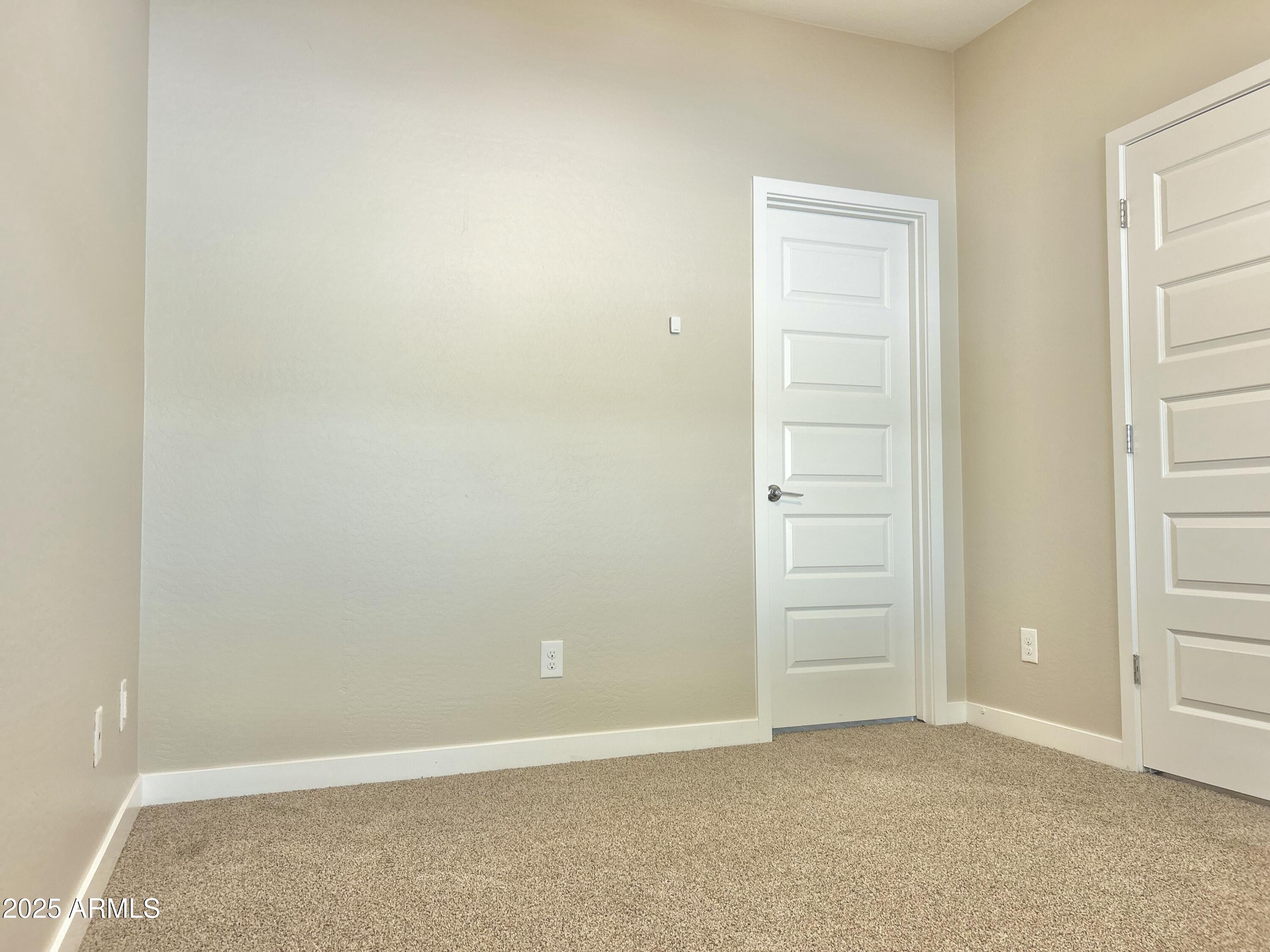 4038 East Erie Street, Unit 103 Gilbert, AZ 85295 - Photo 4 of 16 an empty room with closet area