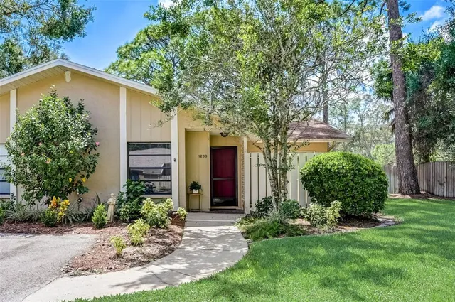 front view of a house with a yard