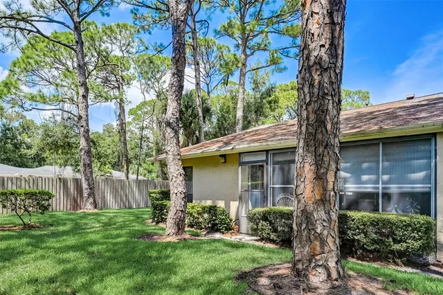 a view of a house with a yard and plants