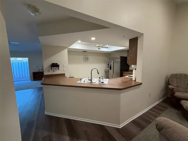 a view of dining room with furniture and wooden floor