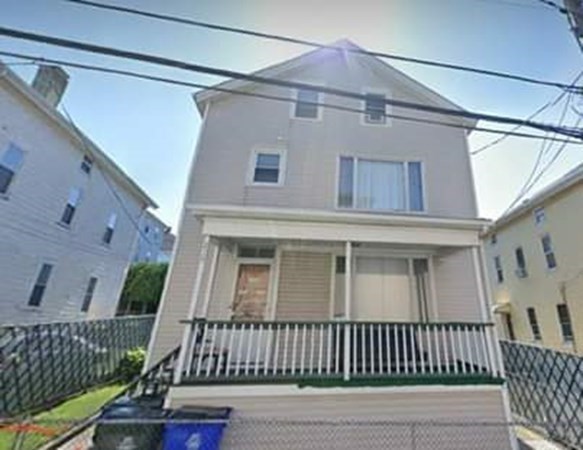 219 William Street Fall River, MA 02721 - Photo 2 of 14 a view of a brick house with a window