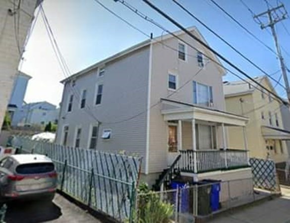 219 William Street Fall River, MA 02721 - Photo 3 of 14 a front view of a house with parking