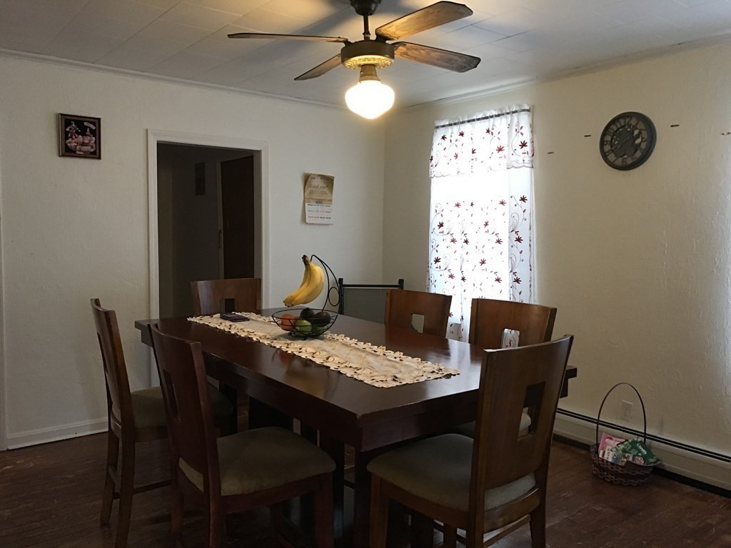 219 William Street Fall River, MA 02721 - Photo 5 of 14 a view of a dining room with a table and chairs