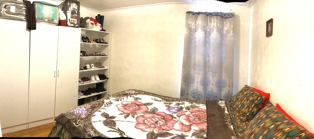 219 William Street Fall River, MA 02721 - Photo 7 of 14 a bedroom with a bed and a chandelier