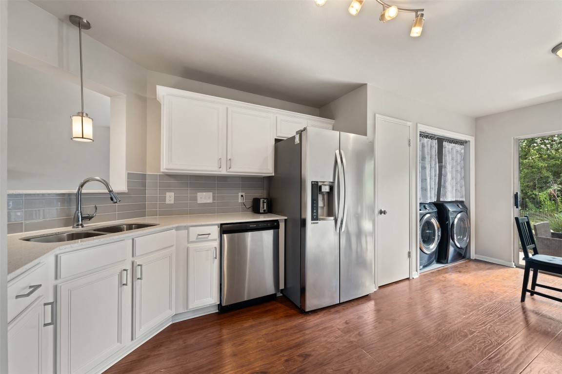 2004 Yaupon Trail Cedar Park, TX 78613 - Photo 11 of 33 a kitchen with stainless steel appliances granite countertop a refrigerator and a sink