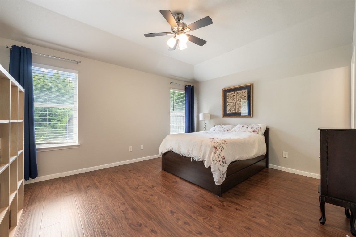 2004 Yaupon Trail Cedar Park, TX 78613 - Photo 18 of 33 a bed sitting in a bedroom next to a window
