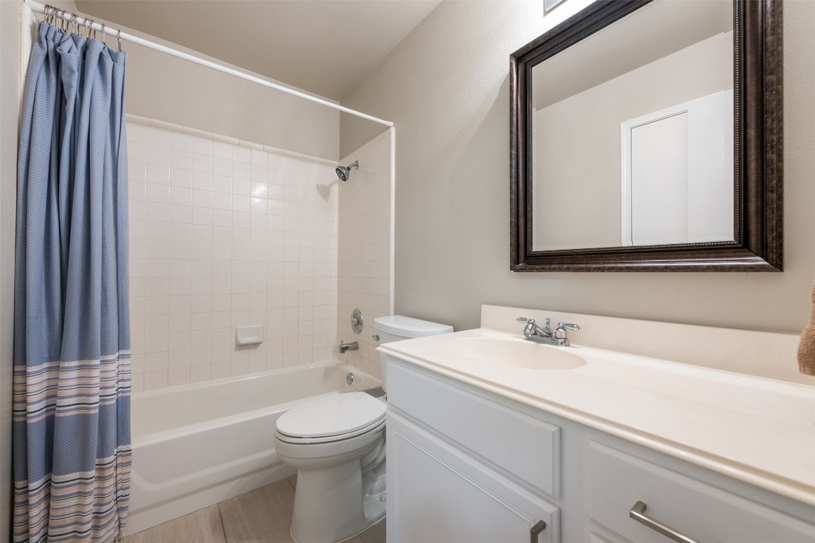 2004 Yaupon Trail Cedar Park, TX 78613 - Photo 24 of 33 a bathroom with a sink a toilet and shower