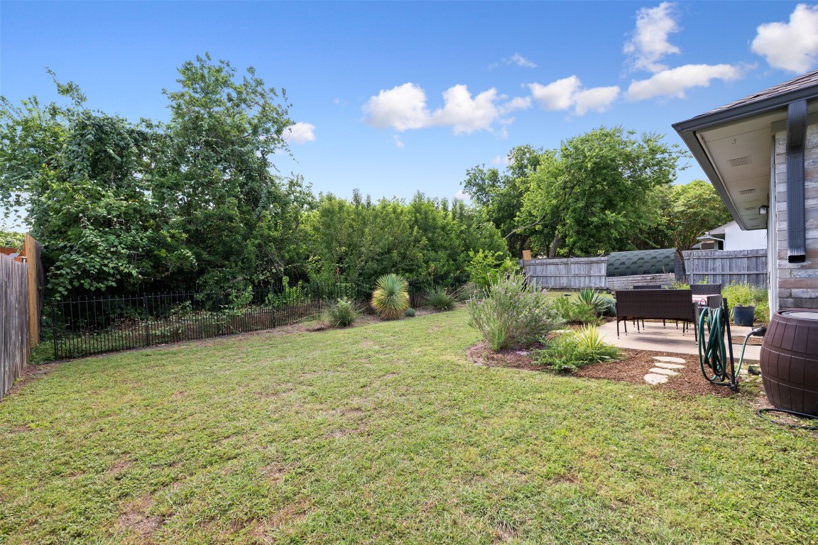 2004 Yaupon Trail Cedar Park, TX 78613 - Photo 26 of 33 a backyard of a house with lots of green space