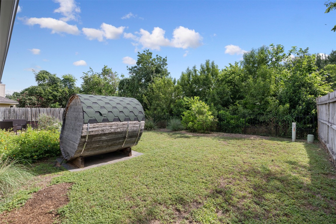2004 Yaupon Trail Cedar Park, TX 78613 - Photo 33 of 33 a yellow house with lots of trees in the background