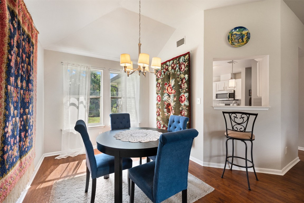2004 Yaupon Trail Cedar Park, TX 78613 - Photo 8 of 33 a view of a dining room with furniture window and wooden floor