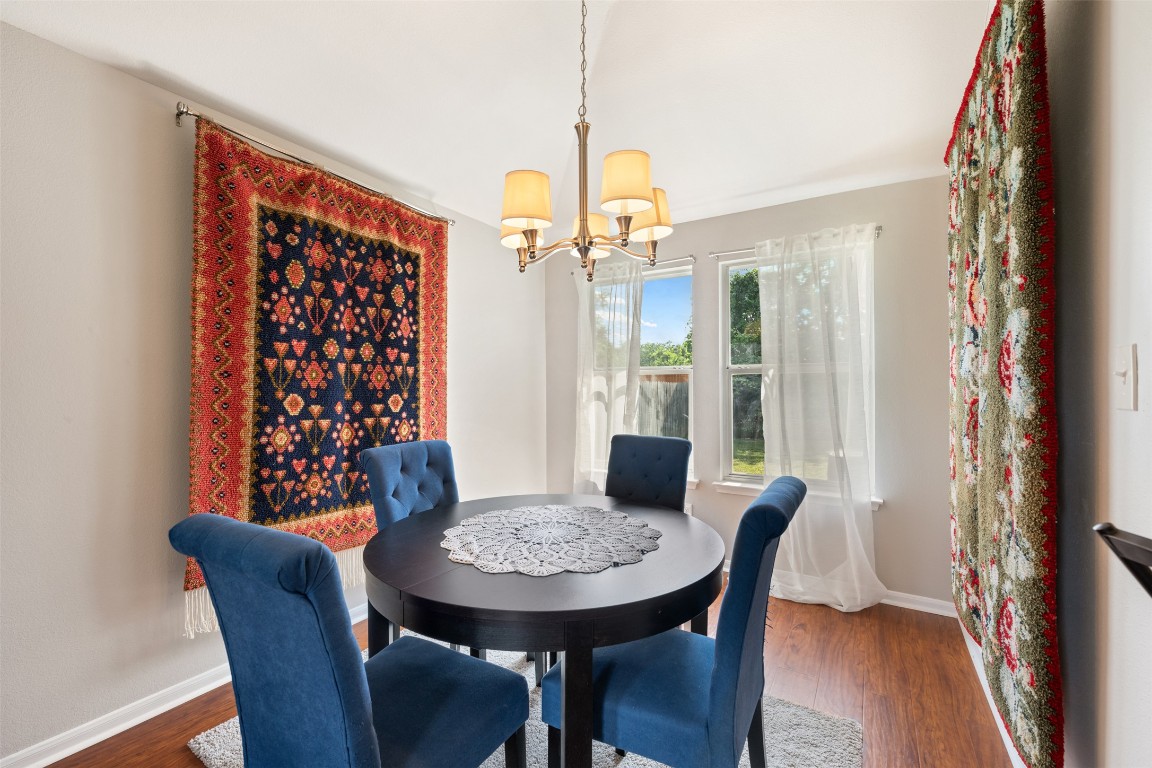 2004 Yaupon Trail Cedar Park, TX 78613 - Photo 9 of 33 a view of a dining room with furniture and wooden floor