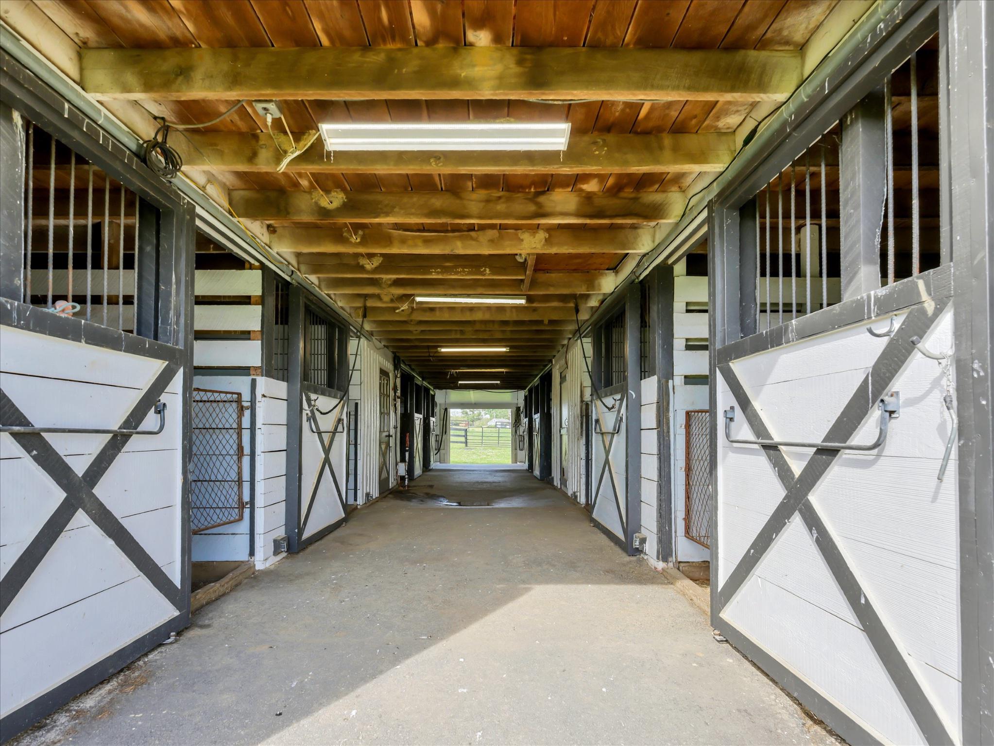 19255 Telegraph Springs Road Purcellville, VA 20132 - Photo 55 of 107 Spacious equestrian barn interior with 8 stalls.
