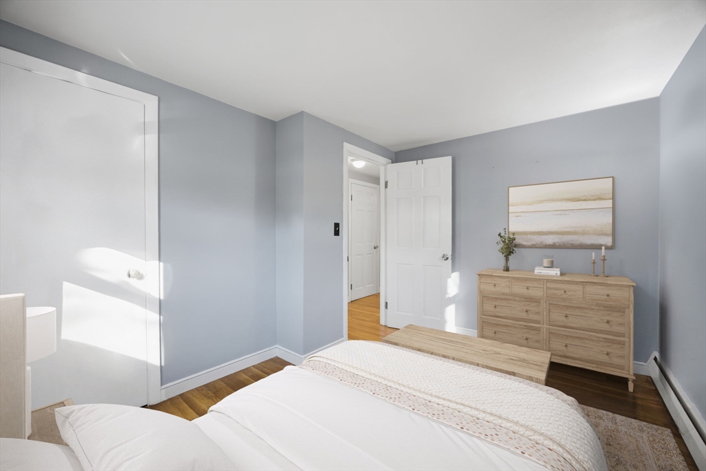 55 Maynard Road Dedham, MA 02026 - Photo 14 of 38 a bedroom with a bed and furniture