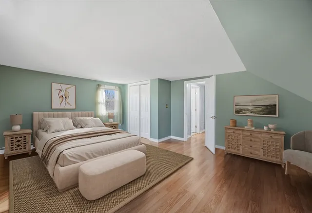 a bedroom with a bed and a couch