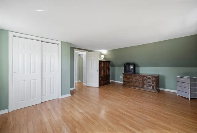 a view of a livingroom with wooden floor
