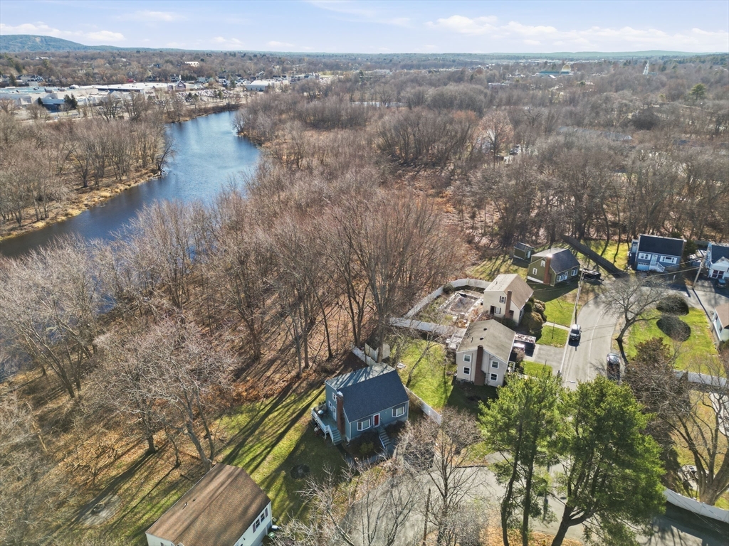 55 Maynard Road Dedham, MA 02026 - Photo 2 of 38 a view of a lake with a mountain in the back