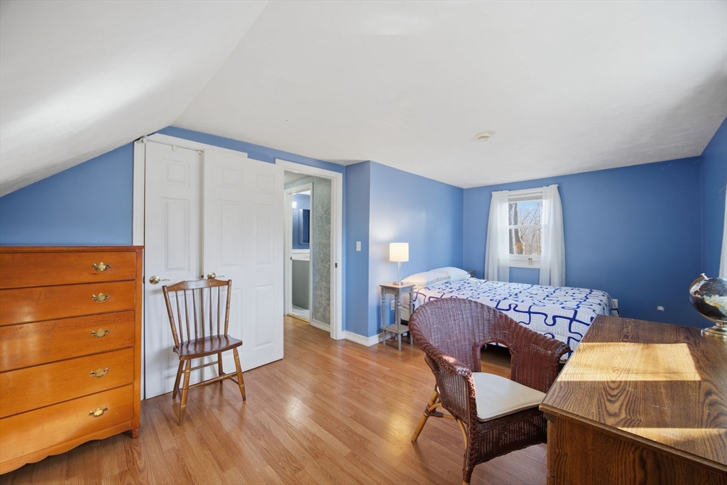 55 Maynard Road Dedham, MA 02026 - Photo 22 of 38 a bedroom with a bed and a dresser in it