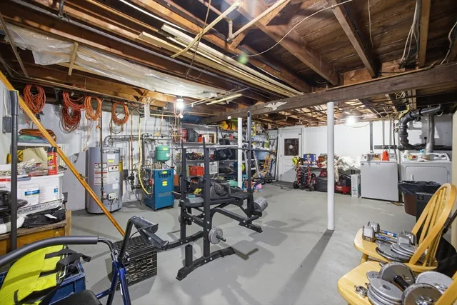 a view of a roof deck with table and chairs and wooden floor