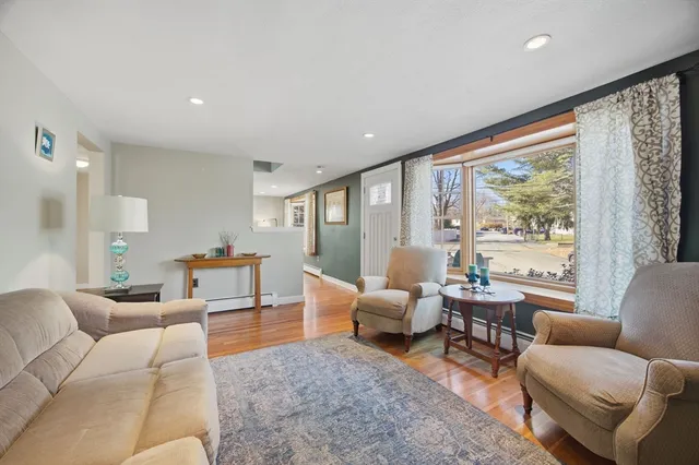 a living room with furniture and large windows