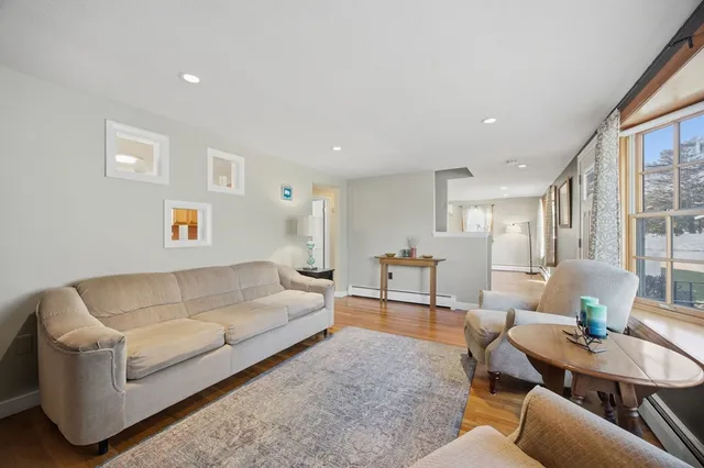 a living room with furniture and a table