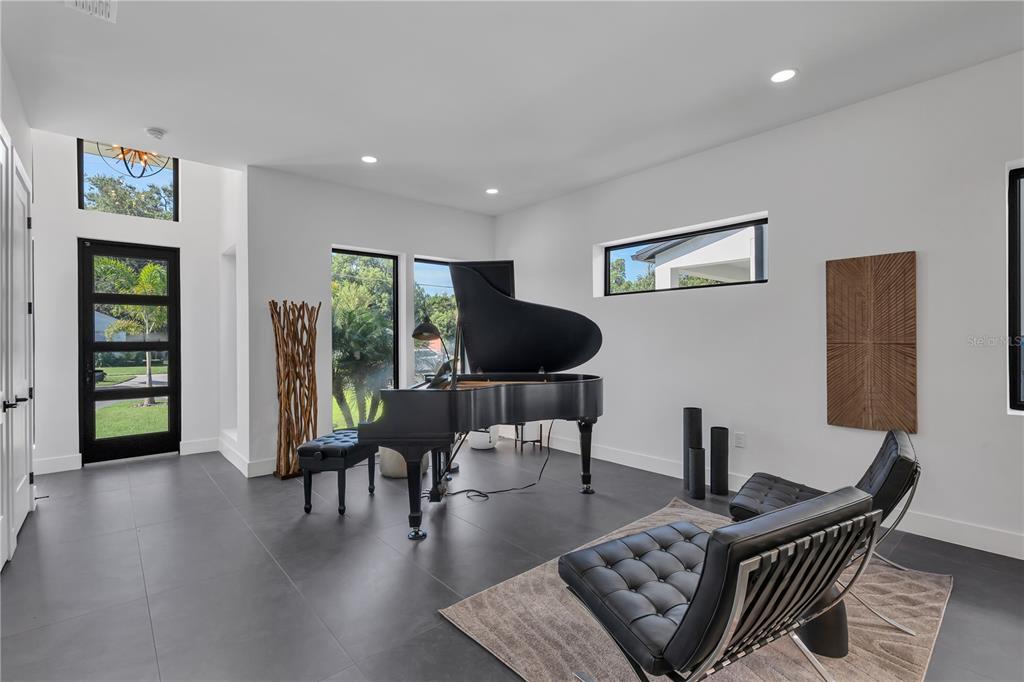 239 East Harding Street Orlando, FL 32806 - Photo 11 of 60 a living room with furniture and a flat screen tv