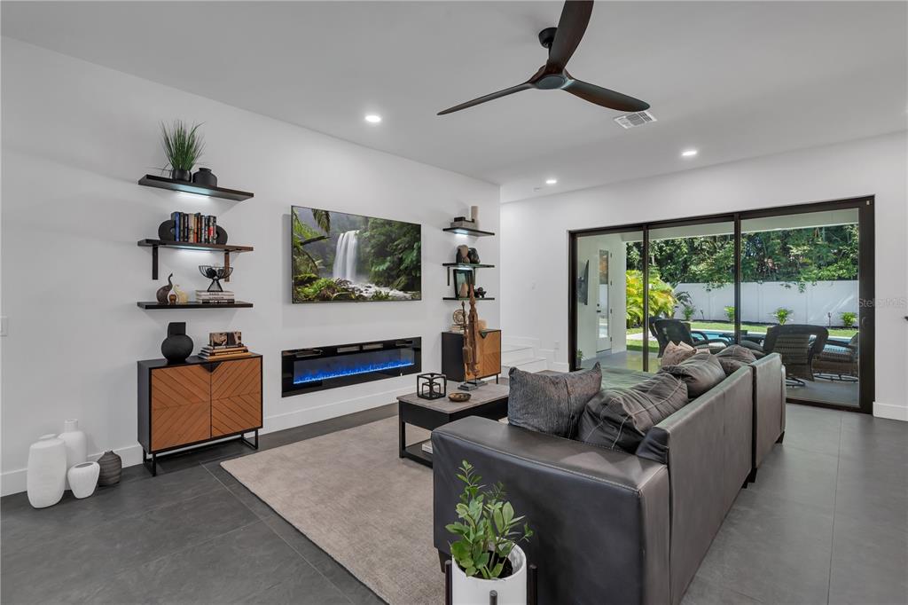 239 East Harding Street Orlando, FL 32806 - Photo 19 of 60 a living room with furniture and a flat screen tv