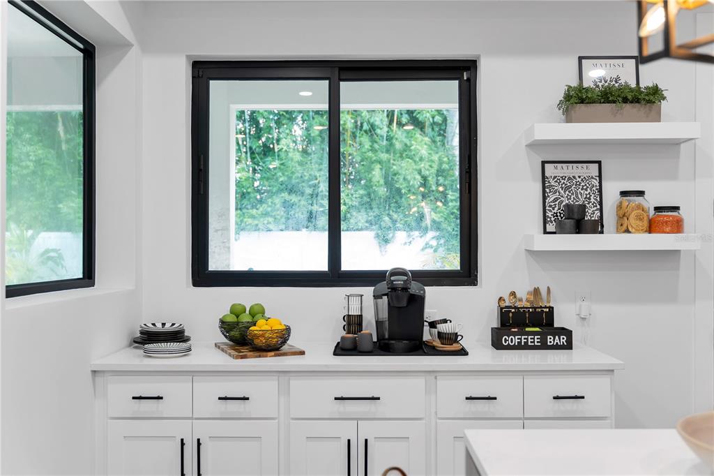 239 East Harding Street Orlando, FL 32806 - Photo 28 of 60 a kitchen with stainless steel appliances a counter space and window