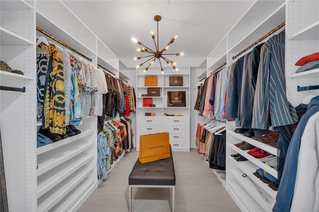 239 East Harding Street Orlando, FL 32806 - Photo 36 of 60 a view of walk in closet with clothes and shoes