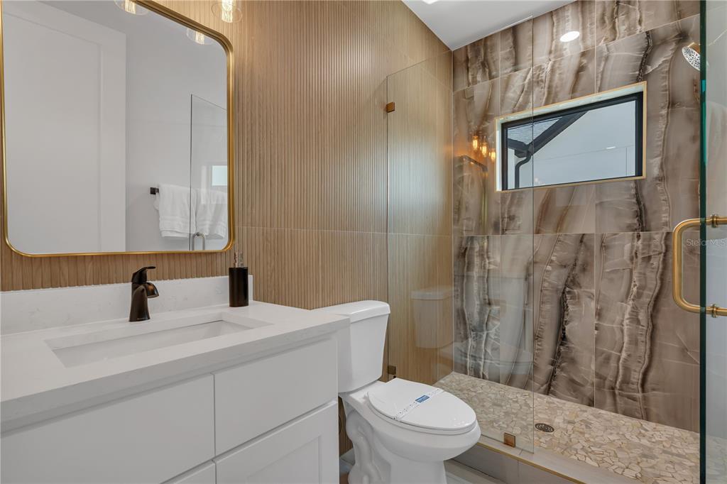 239 East Harding Street Orlando, FL 32806 - Photo 49 of 60 a bathroom with a sink a toilet and shower