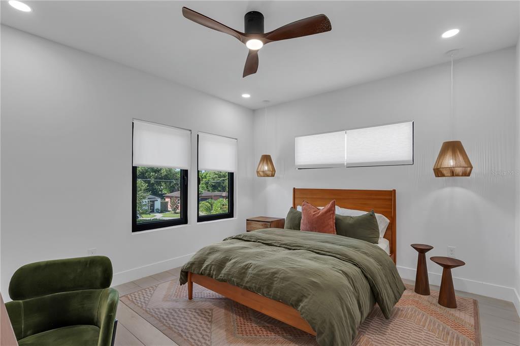 239 East Harding Street Orlando, FL 32806 - Photo 51 of 60 a bedroom with a large bed and a window