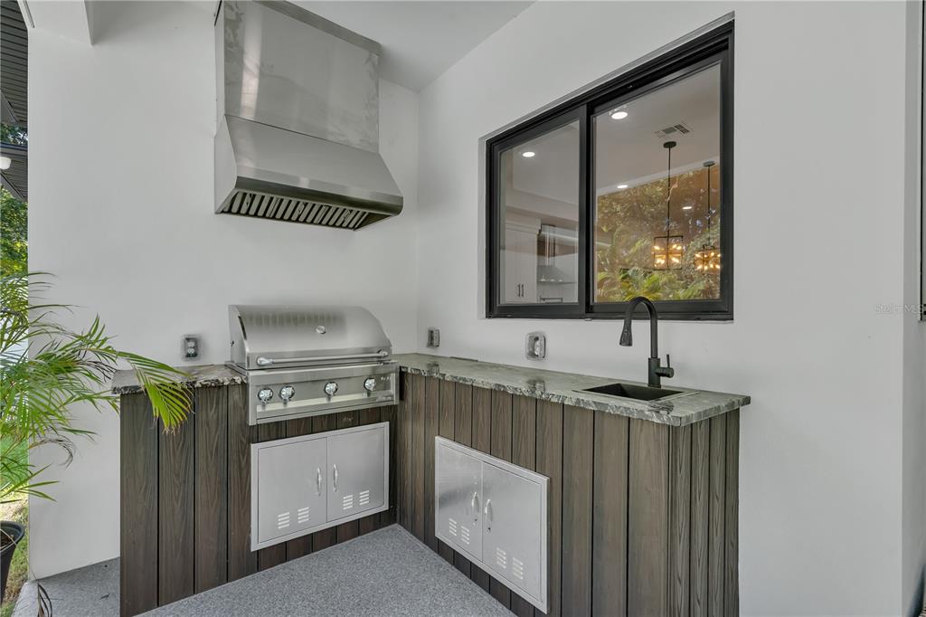 239 East Harding Street Orlando, FL 32806 - Photo 55 of 60 a kitchen with a sink and a stove