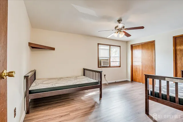 a bedroom with furniture and window