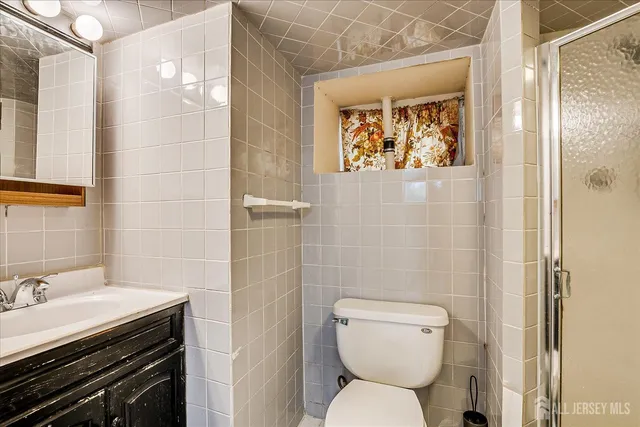 a bathroom with a toilet a sink and a shower