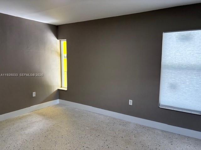 828 Southwest 20th Avenue, Unit 7 Miami, FL 33135 - Photo 5 of 13 an empty room with a window